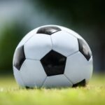 Soccer ball on green lawn